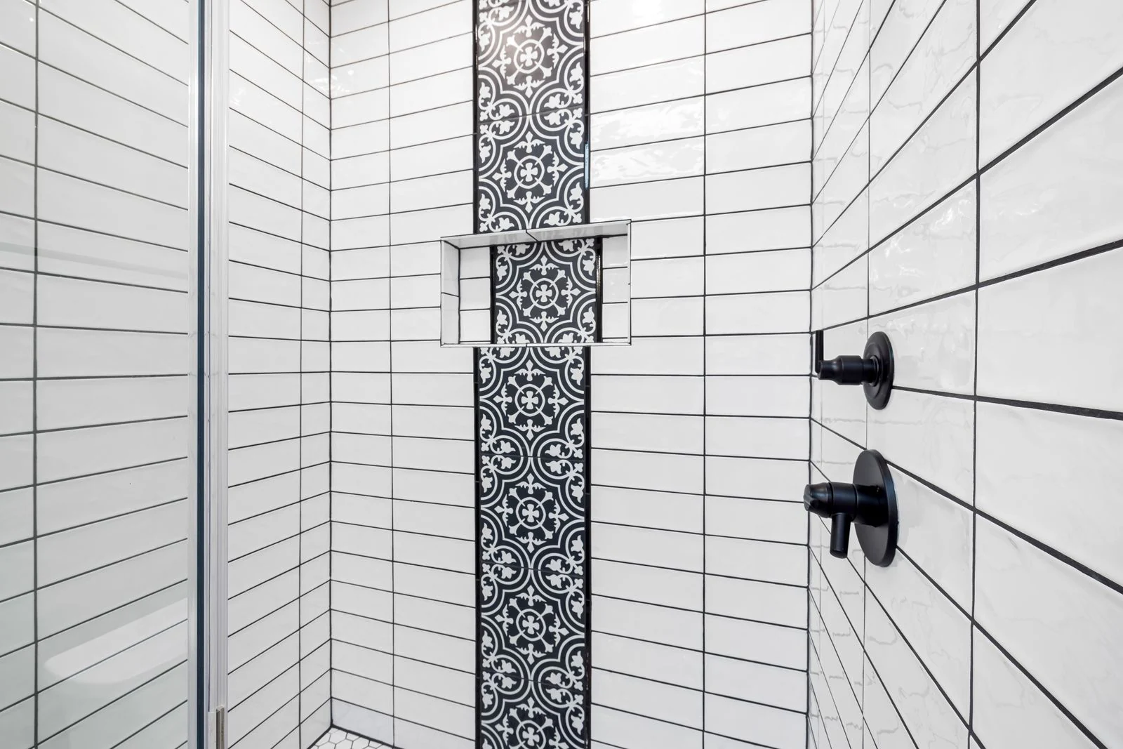 Patterned shower tiles and controls