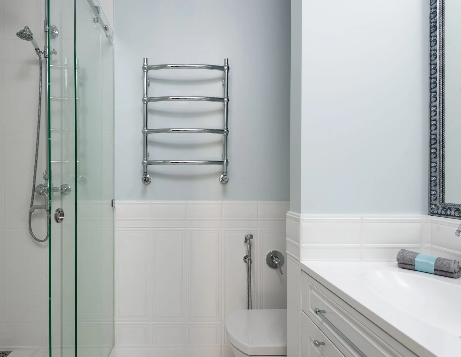 Shower fitting and heated towel rail